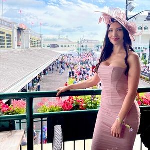 Blush sinamay handmade kentucky derby fascinator hat with headband attached.